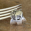 Detailed close up of elephant on sterling silver elephant demitasse spoon ring - handcrafted from upcycled vintage silverware - Laughing Frog Studio
