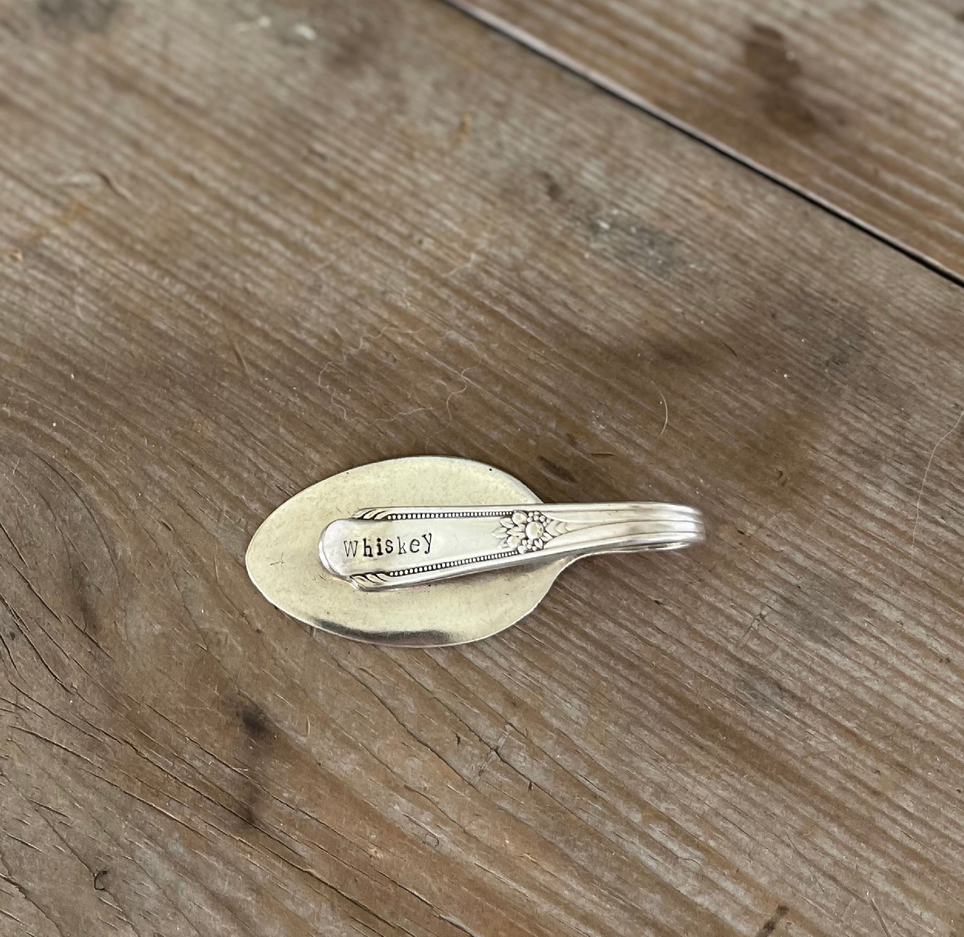 Vintage silverplate spoon money clip stamped WHISKEY - front view with patina