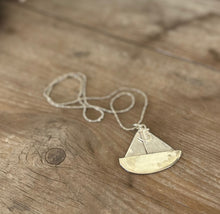 upcycled vintage silverware necklace shaped like a sailboat with an anchor