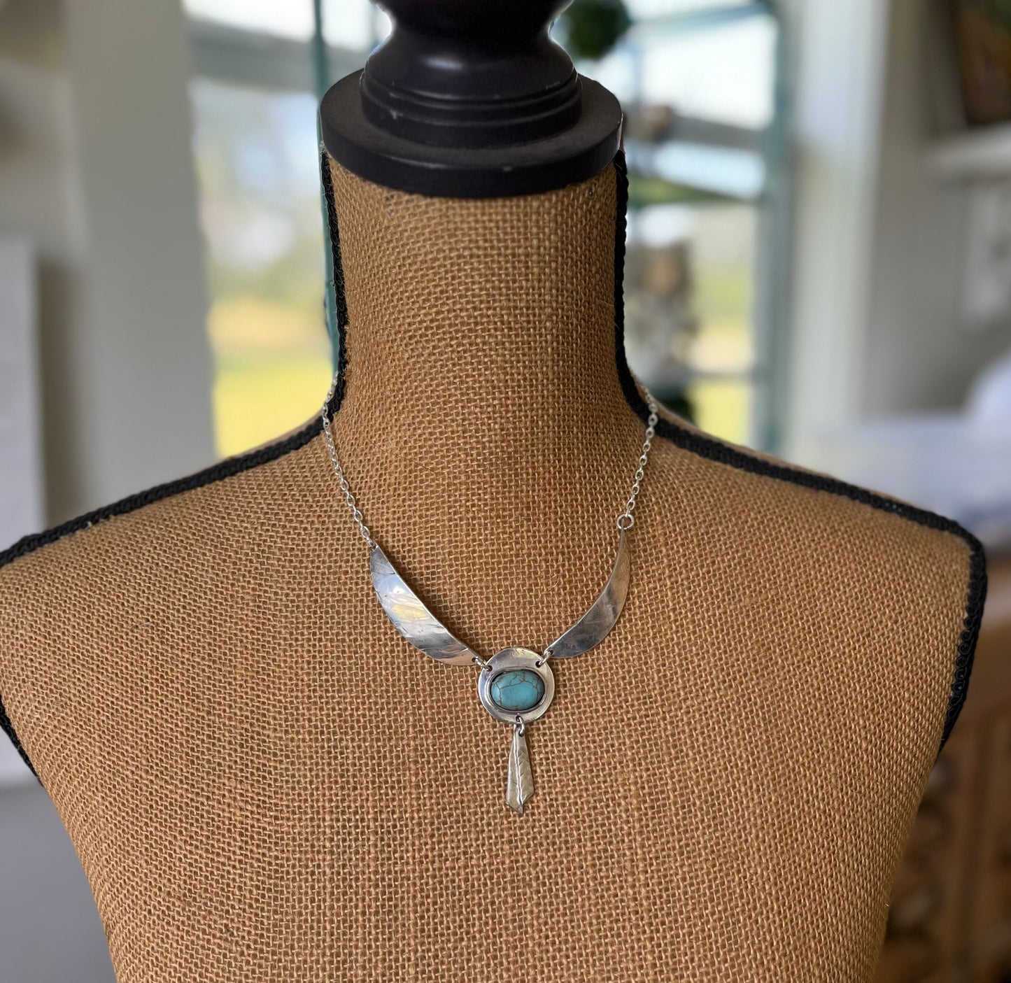 Handcrafted Native American style necklace with fork tine feathers and turquoise colored stone