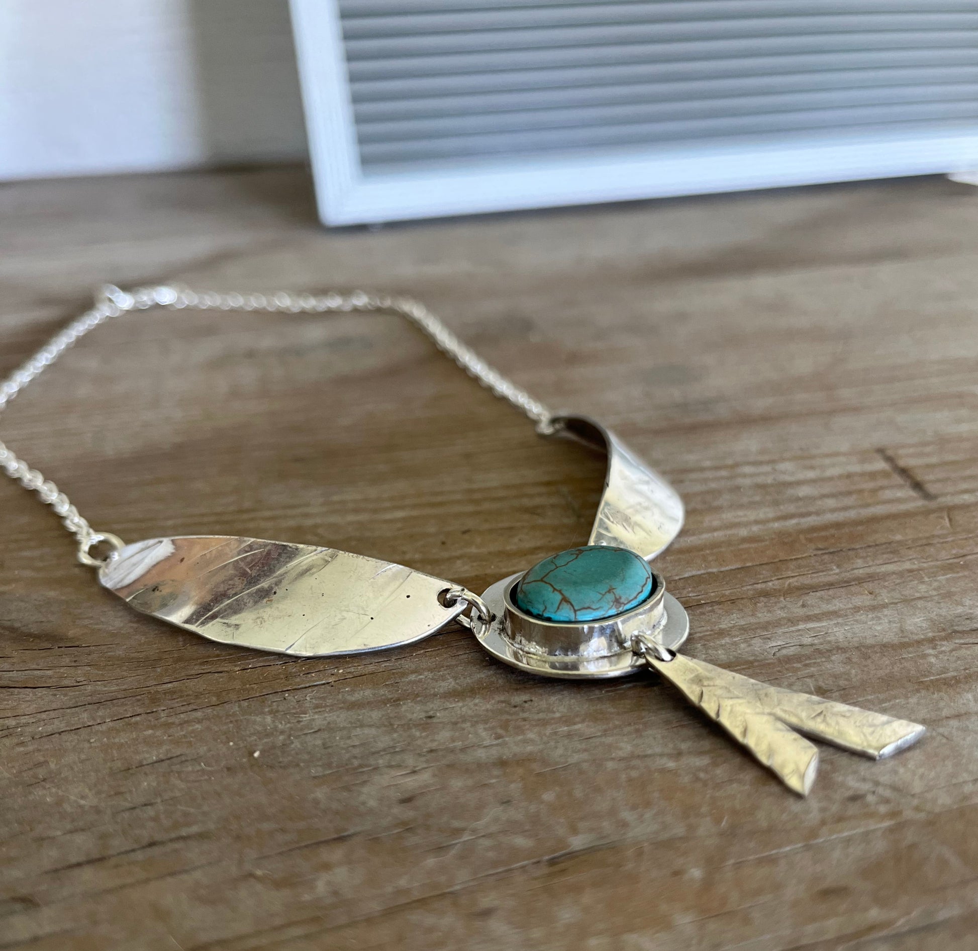 Side view of Artisan Native Wings statement necklace - one-of-a-kind upcycled silverware gift