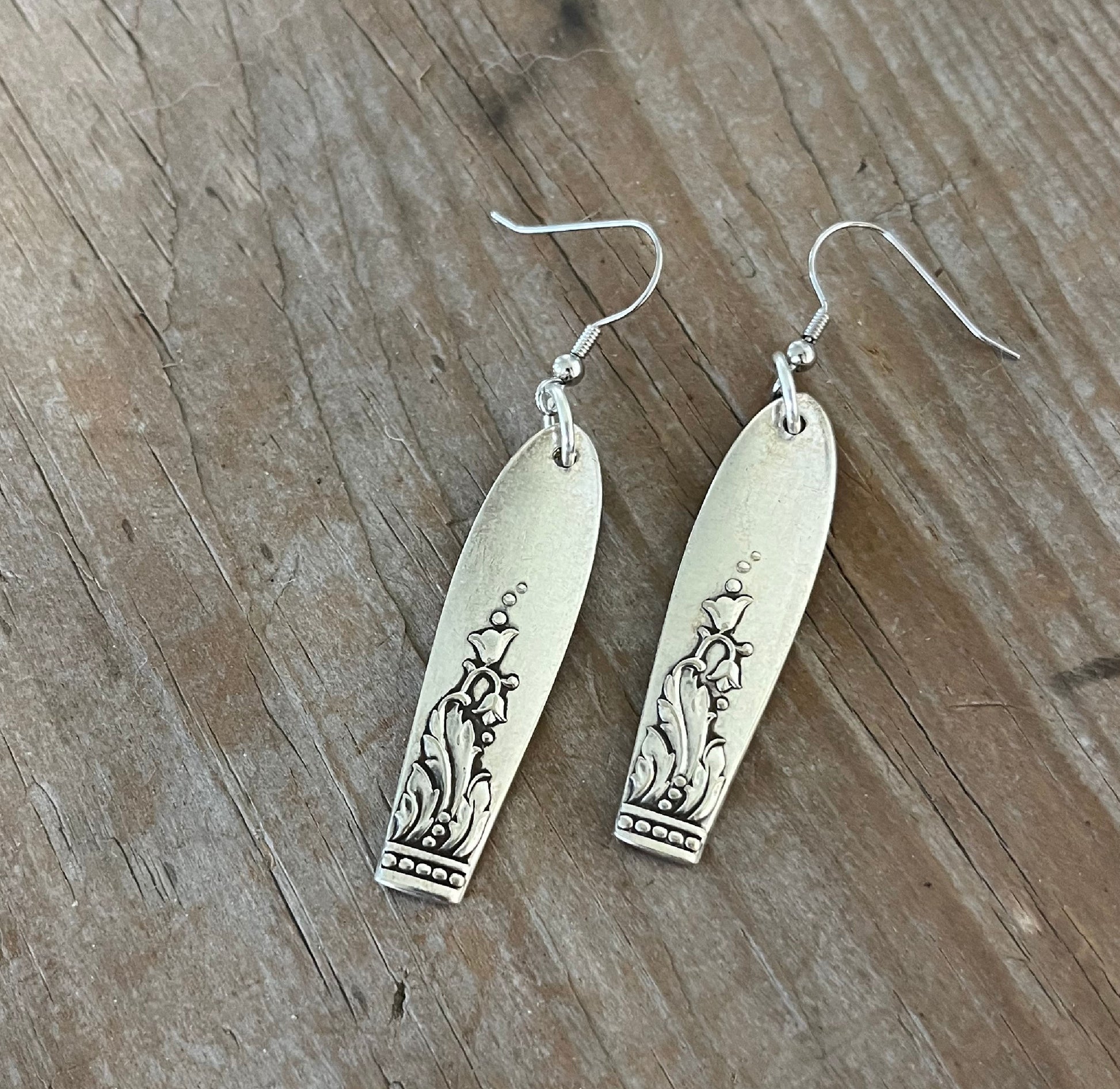 Handmade Snow Drop spoon earrings showing sweet floral silverware design and vintage silverplate patina