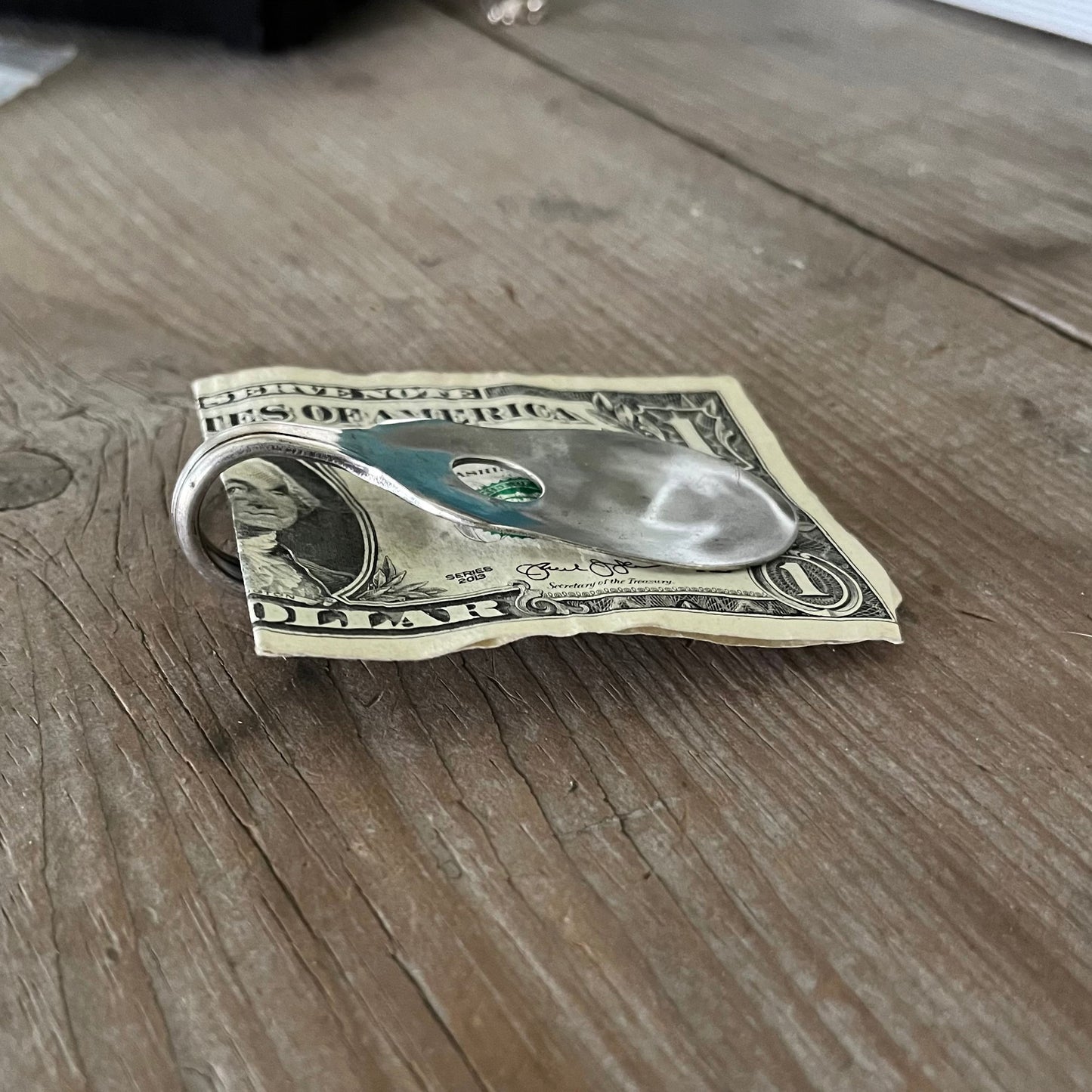 Side view of upcycled silverplate spoon guitar money clip VISION showing clip mechanism