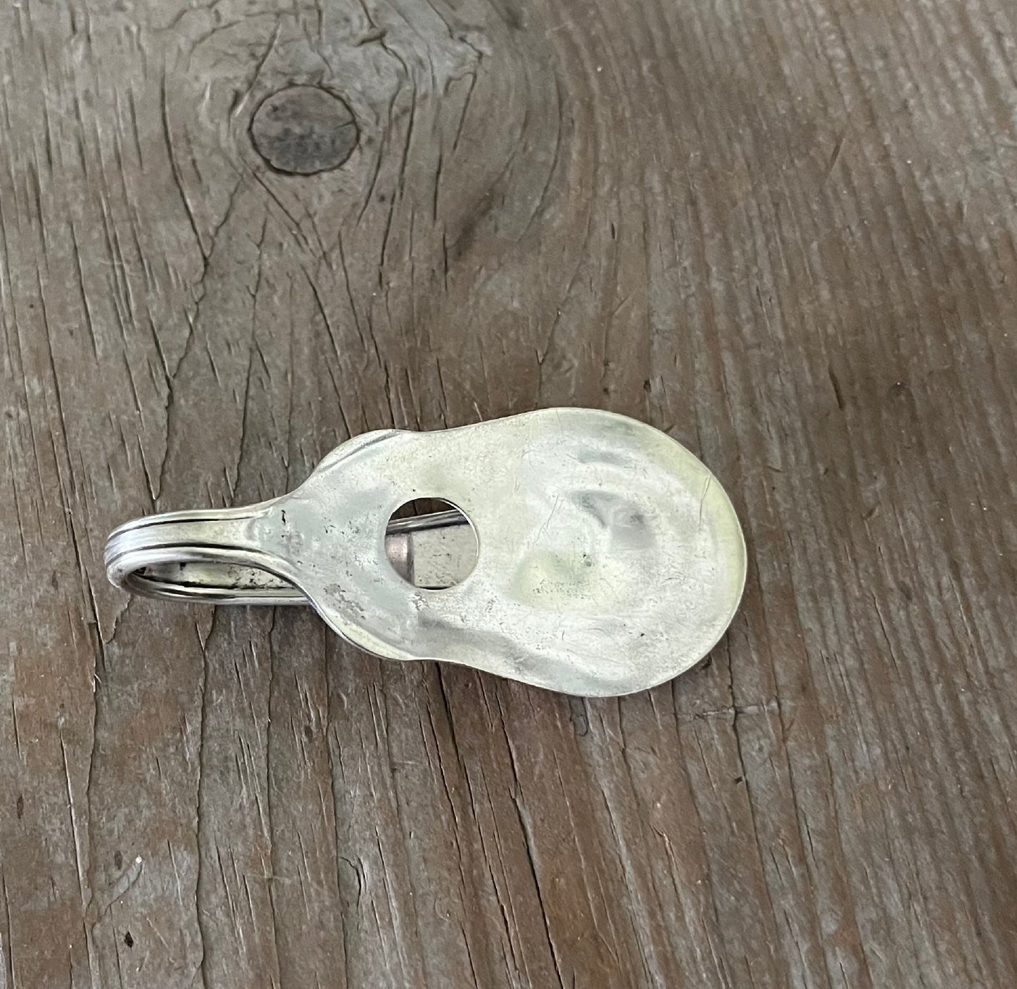 Vintage Vision pattern spoon guitar money clip with sound hole cutout - front view of contoured shape