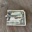 Handcrafted spoon guitar money clip VISION showing floral spray fretboard detail