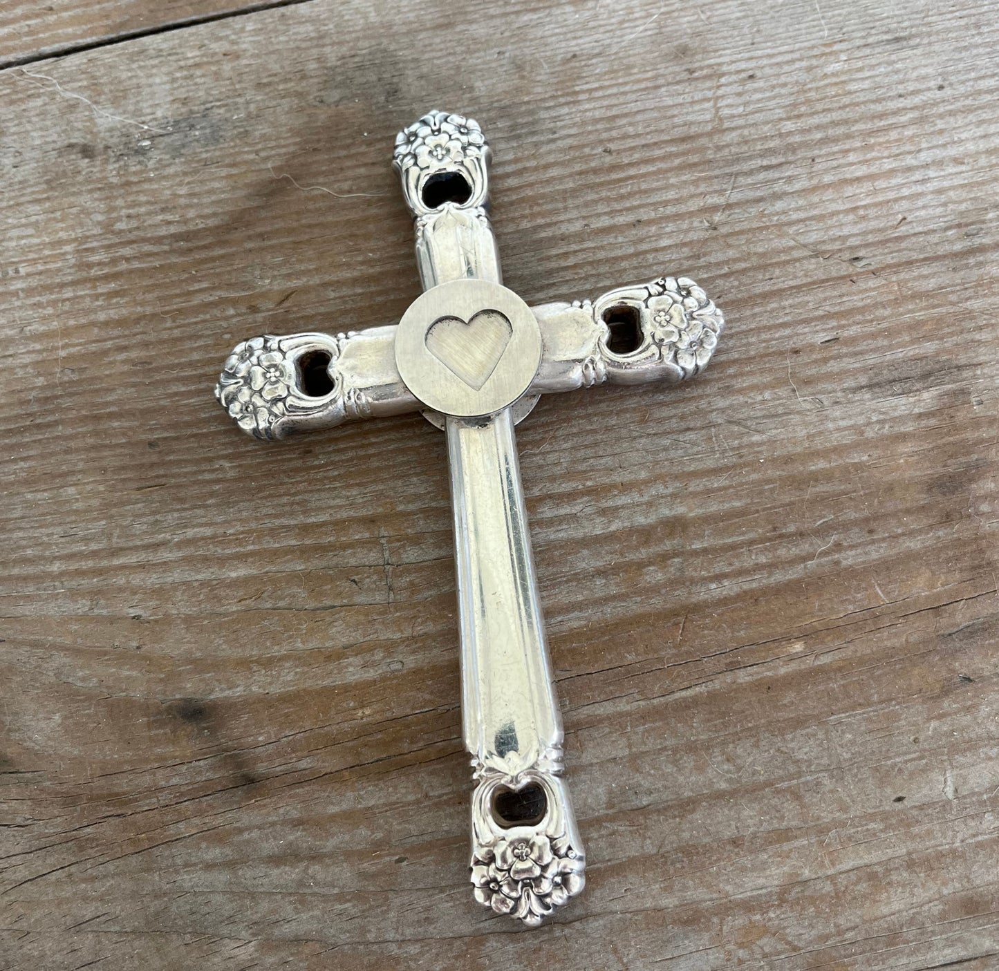 Heart detail on reverse side of Eternally Yours knife cross bible page weight - upcycled vintage silverware