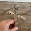 Detail of four-piece construction on Eternally Yours pattern knife cross made from vintage 1847 Rogers hollow handles