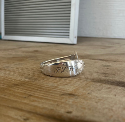 FLW monogram spoon cuff bracelet front view - handcrafted from upcycled vintage silverware 