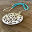 Close-up detail of handcrafted vintage tomato server pendant with turquoise magnesite beads - eco-friendly upcycled silverware jewelry
