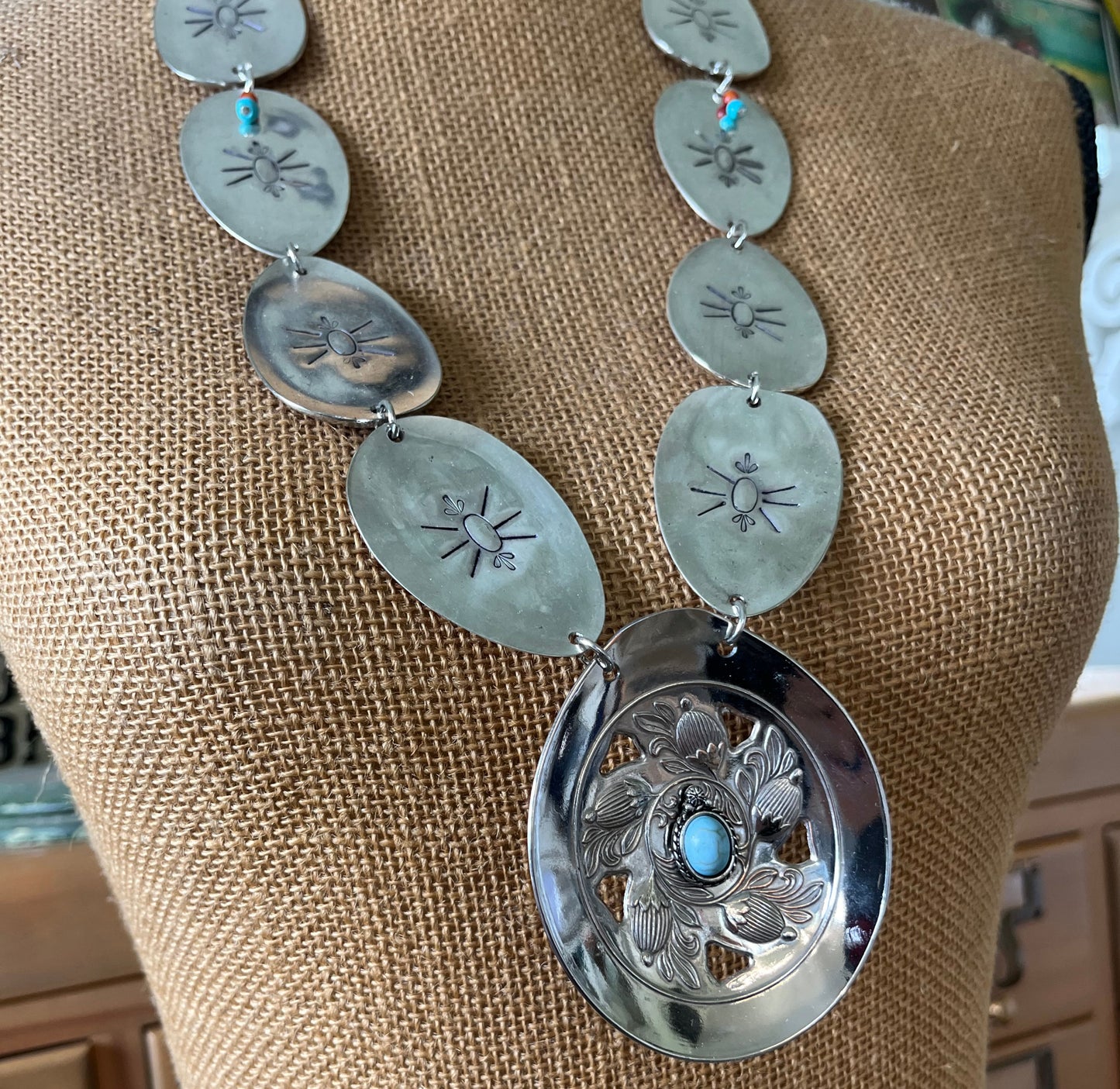 Close up of Product photo of Handcrafted concho necklace from vintage spoon with beetle motif