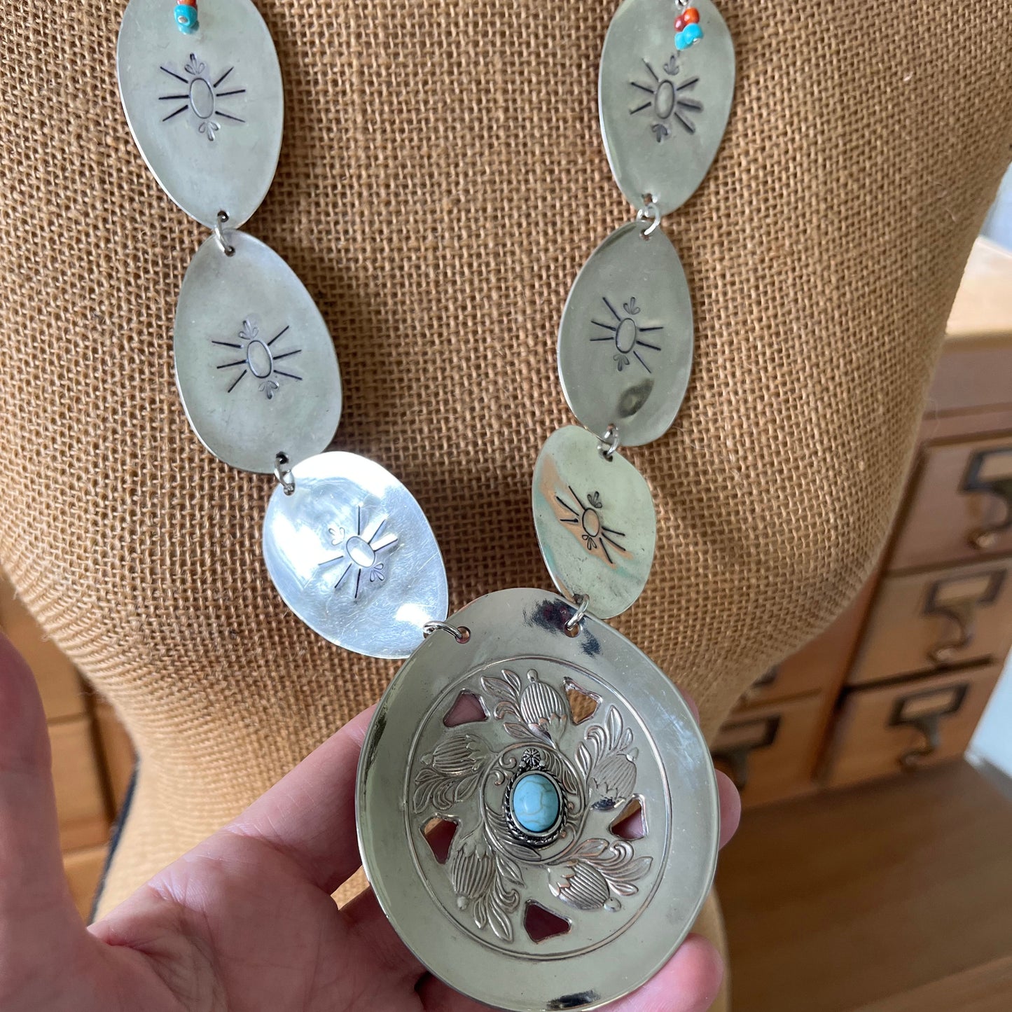 Artisan spoon concho necklace featuring beetle motif - unique statement jewelry
