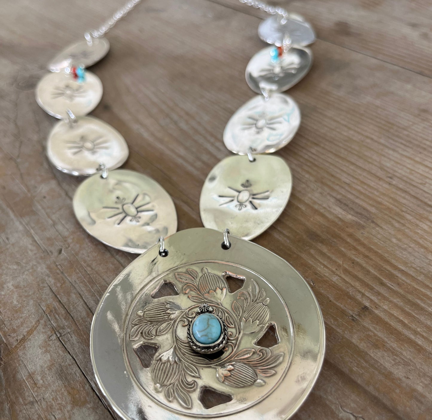 Close up detail of Upcycled spoon concho necklace with beetle - eco-friendly vintage silverware jewelry