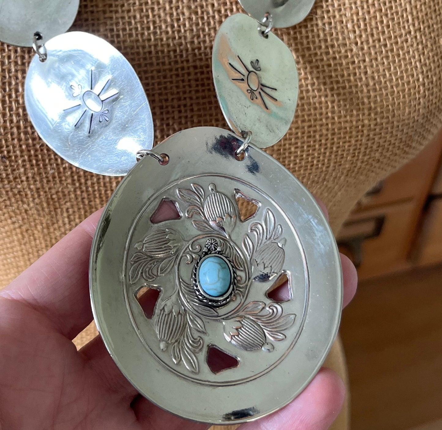 Close up of main pendant on Handmade concho necklace with beetle motif - unique artisan gift