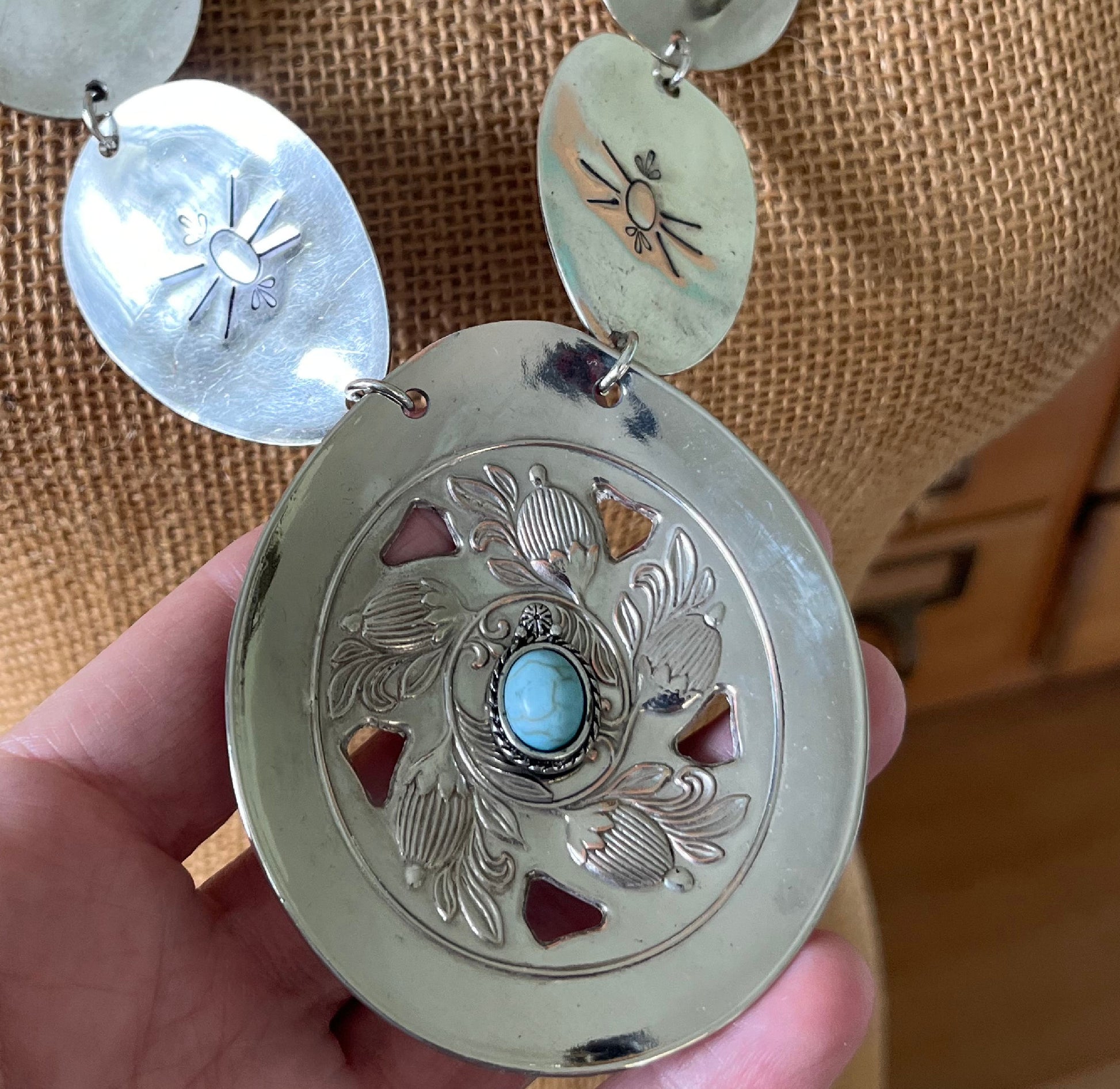 Close up of main pendant on Handmade concho necklace with beetle motif - unique artisan gift