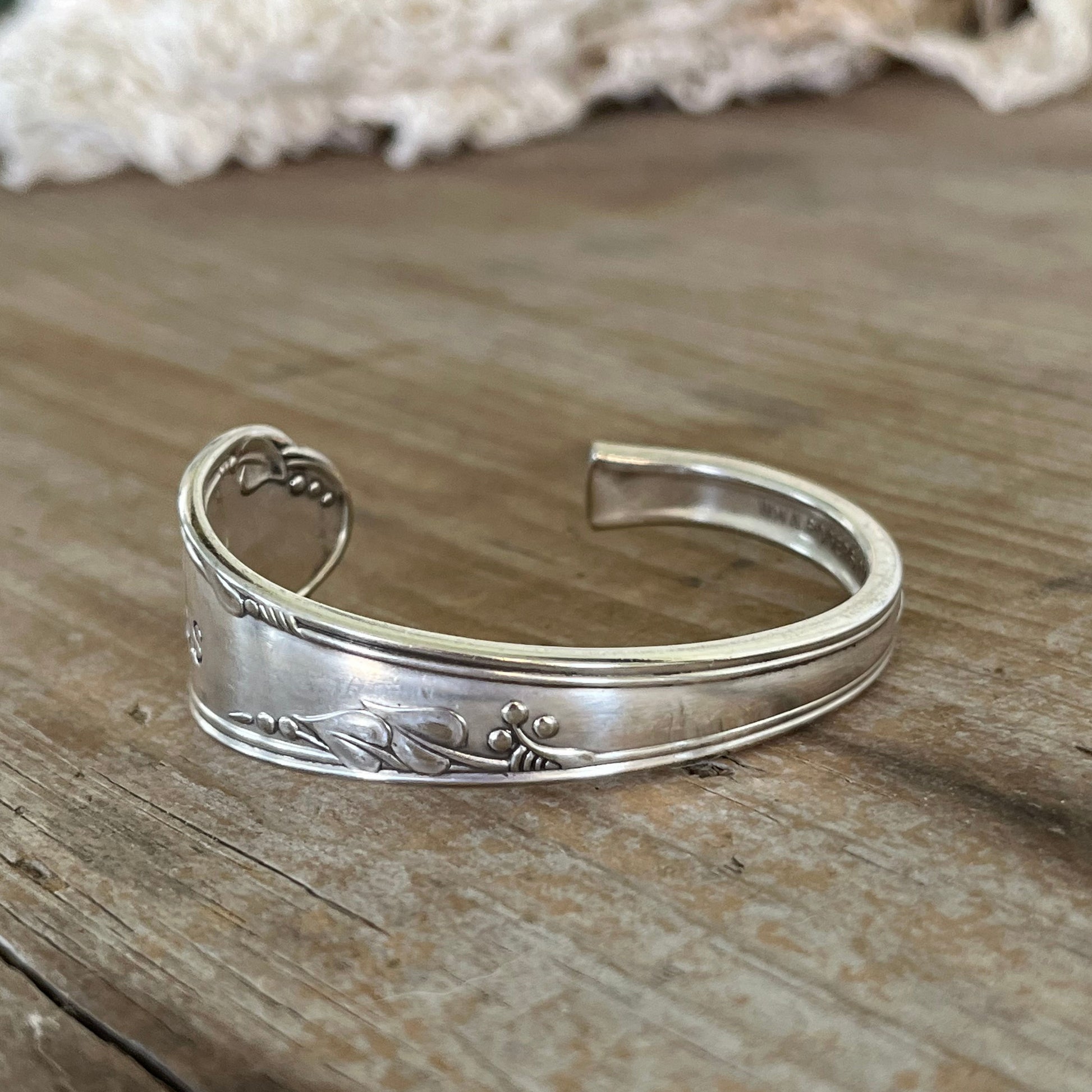 Back view of BADeSS stamped spoon cuff bracelet - handcrafted from upcycled vintage silverware - Laughing Frog Studio