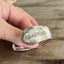 Close up of BADeSS stamped spoon cuff bracelet - handcrafted from upcycled vintage silverware - Laughing Frog Studio