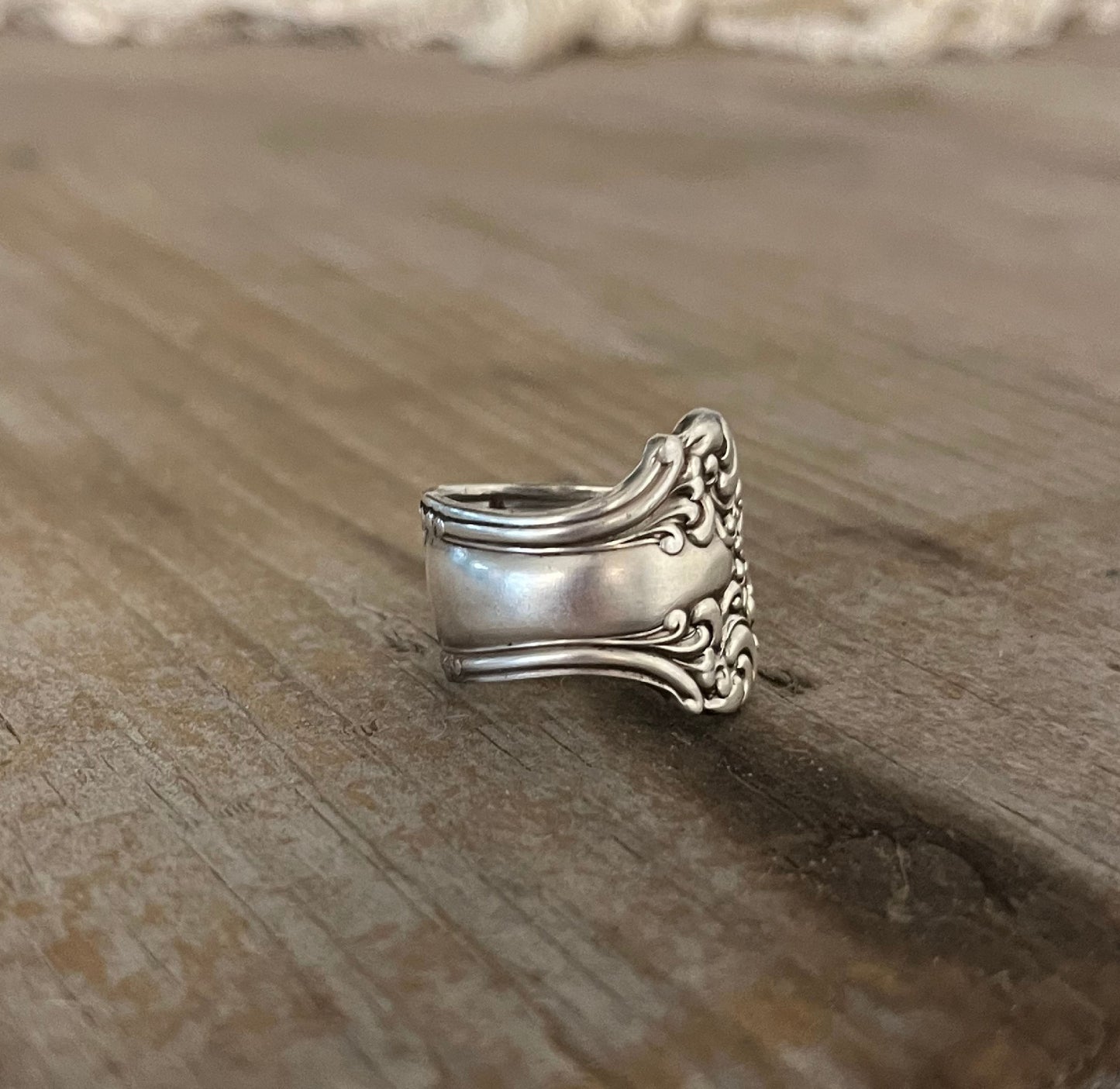 Back view of AVON spoon ring showing curved band and vintage silverware craftsmanship