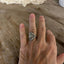 AVON spoon ring worn on finger displaying size and fit of upcycled silverware ring