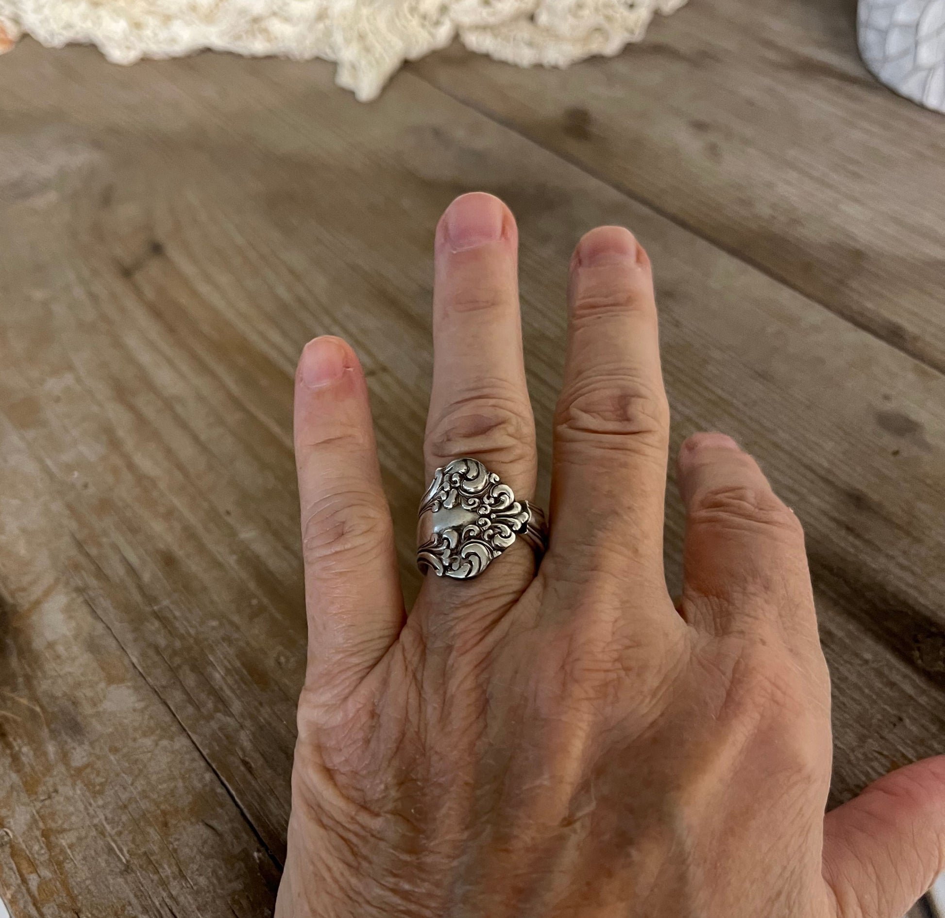 AVON spoon ring worn on finger displaying size and fit of upcycled silverware ring