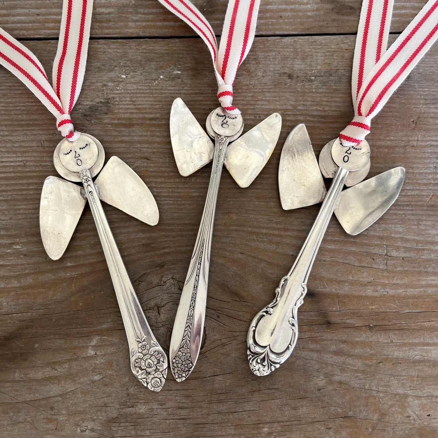 Collection of handmade angel ornaments featuring various vintage upcycled silverware patterns - artisan Christmas decorations