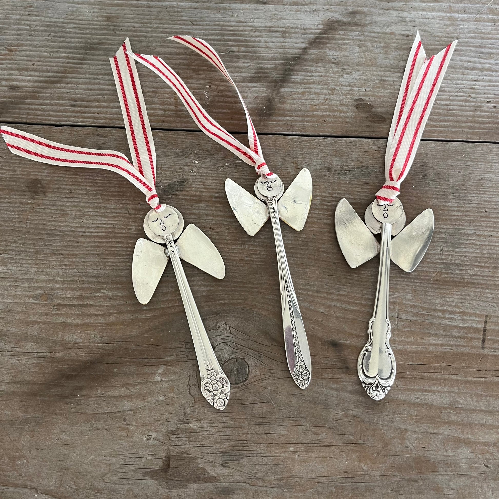 Collection of handmade angel ornaments featuring various upcycled silverware patterns - vintage artisan decorations