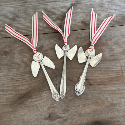 Collection of handmade angel ornaments featuring various patterns of upcycled vintage silverware - artisan Christmas decorations