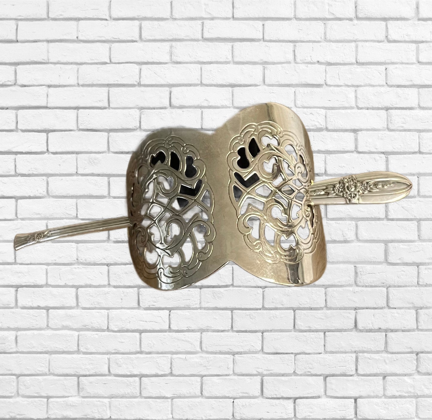 Close up of silverplate half-moon hair barrette with unique detailed filigree design - handcrafted from upcycled vintage silverware - Laughing Frog Studio