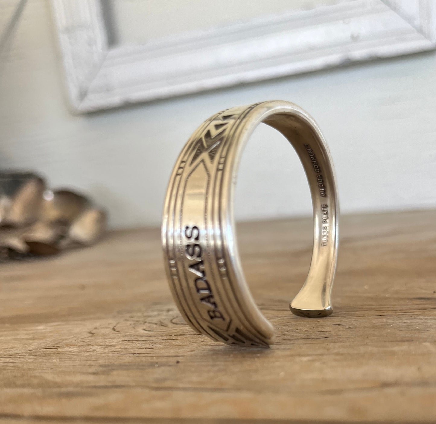 Hand-stamped spoon cuff bracelet from Tudor Plate Friendship/Medality pattern with BADASS message and graceful detailing
