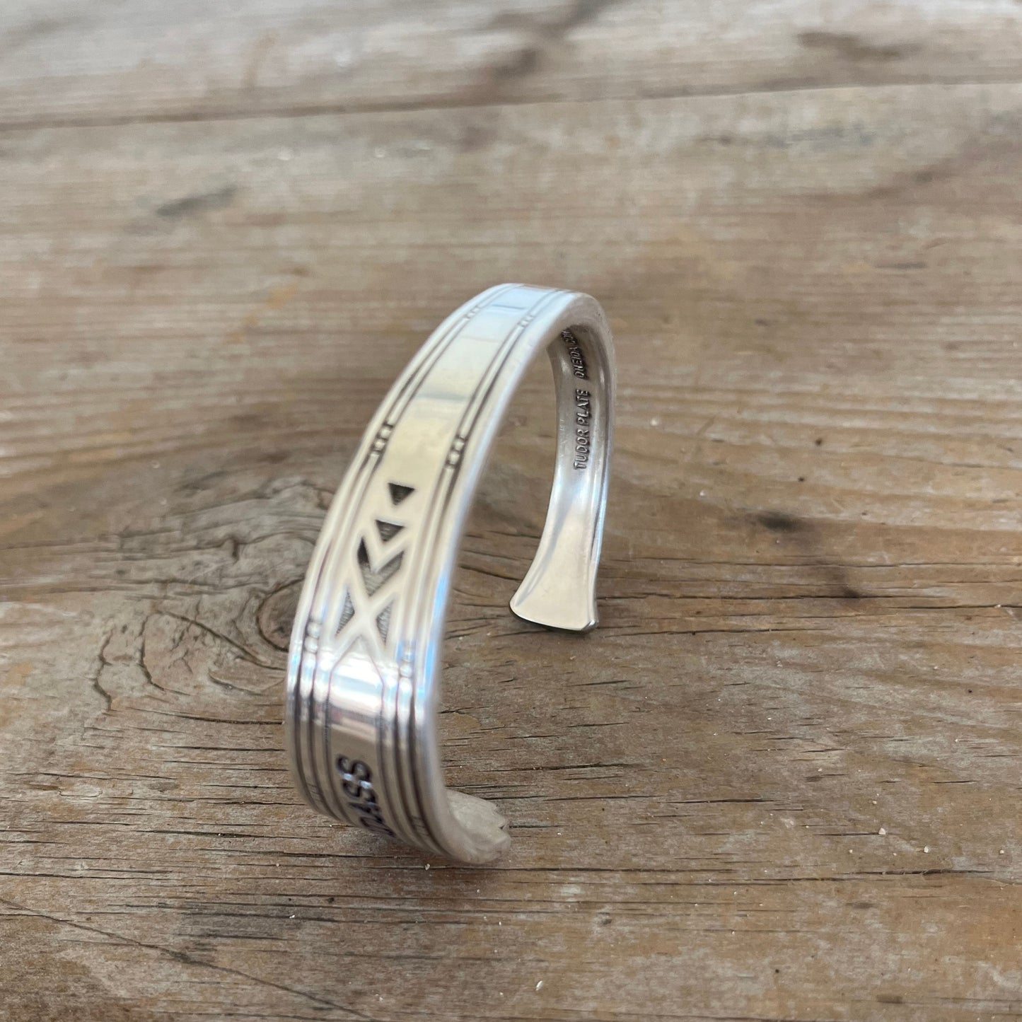 BADASS hand-stamped spoon cuff bracelet front view showing Tudor Plate Medality pattern - handcrafted from upcycled vintage silverware
