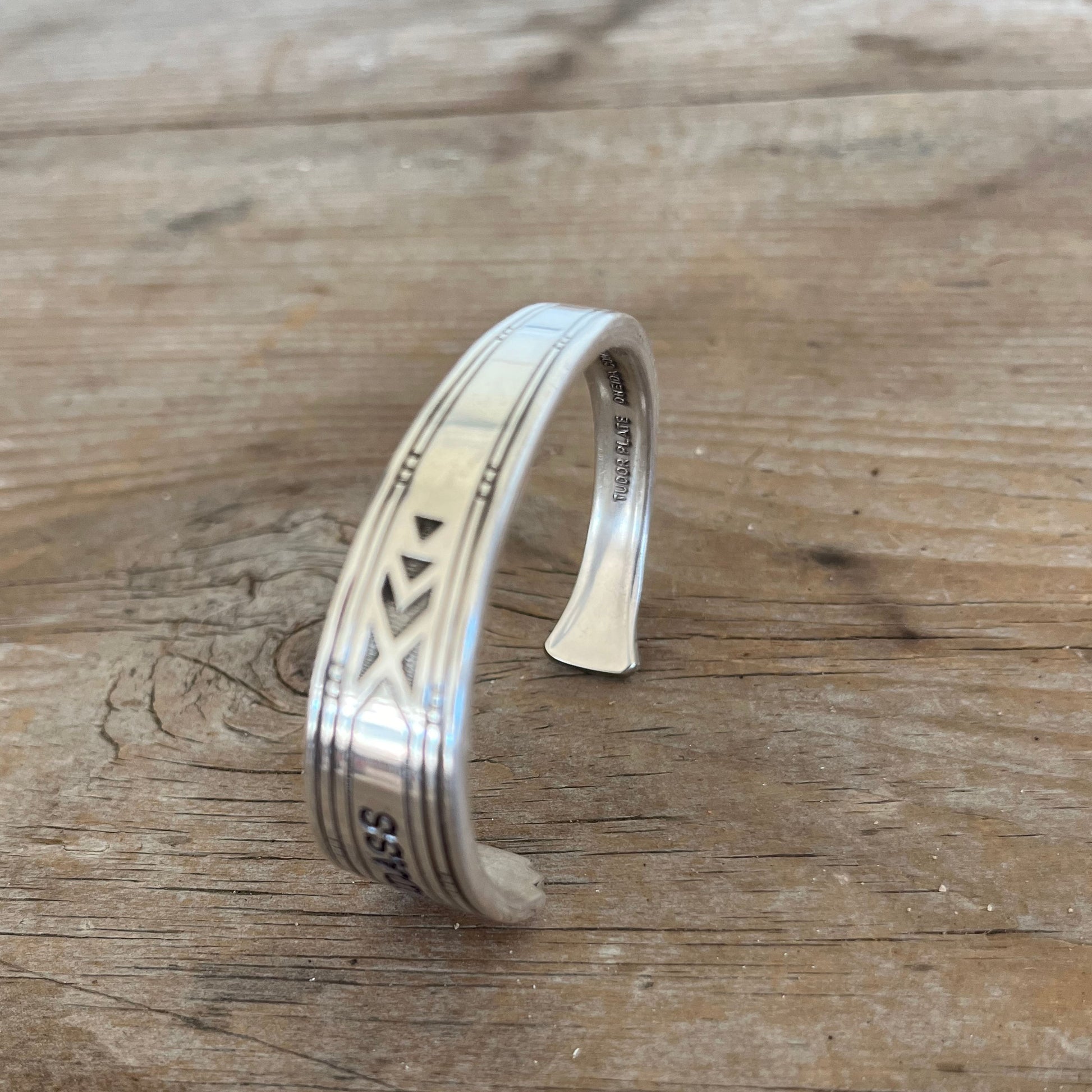 BADASS hand-stamped spoon cuff bracelet front view showing Tudor Plate Medality pattern - handcrafted from upcycled vintage silverware