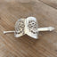 Upcycled silverware hair barrette showing curved cake server design and stick detail