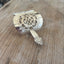 Close up detail of King Cedric Spoon stick portion of cake server hair barrette