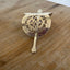 Handcrafted hair barrette from upcycled vintage cake server showing decorative detail