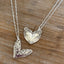 Collection of two silverware heart necklaces displaying two vintage silverware patterns
