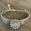 Close-up detail of Queen Bess pattern spoon links with rhinestone button - handmade artisan silverware bracelet