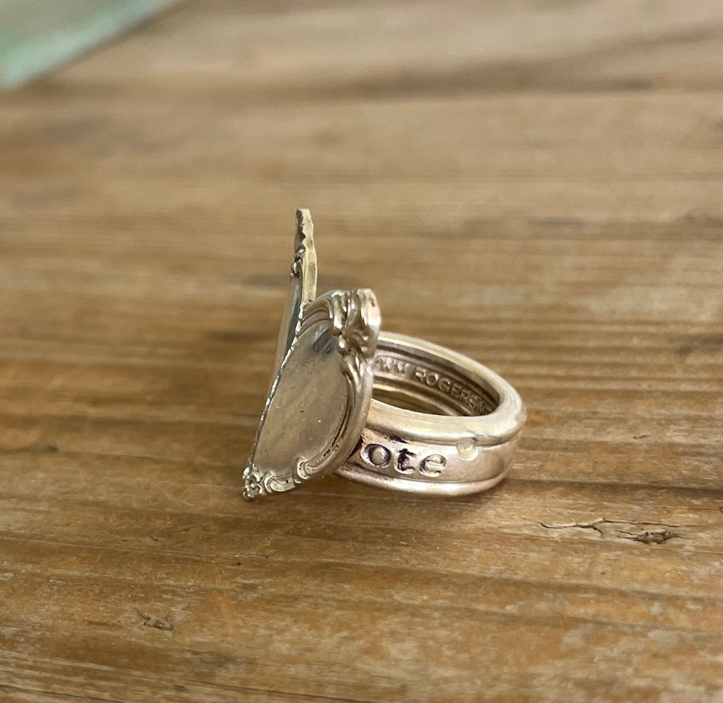 Heart spoon ring showing scrap-bin shank and International Silver Victorian Rose pattern from 1954