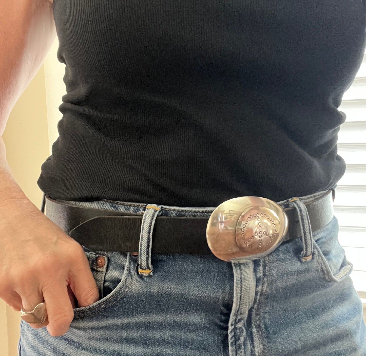 Handmade spoon belt buckle with hand-stamped peace symbol shown on model fits 1.5-inch belt