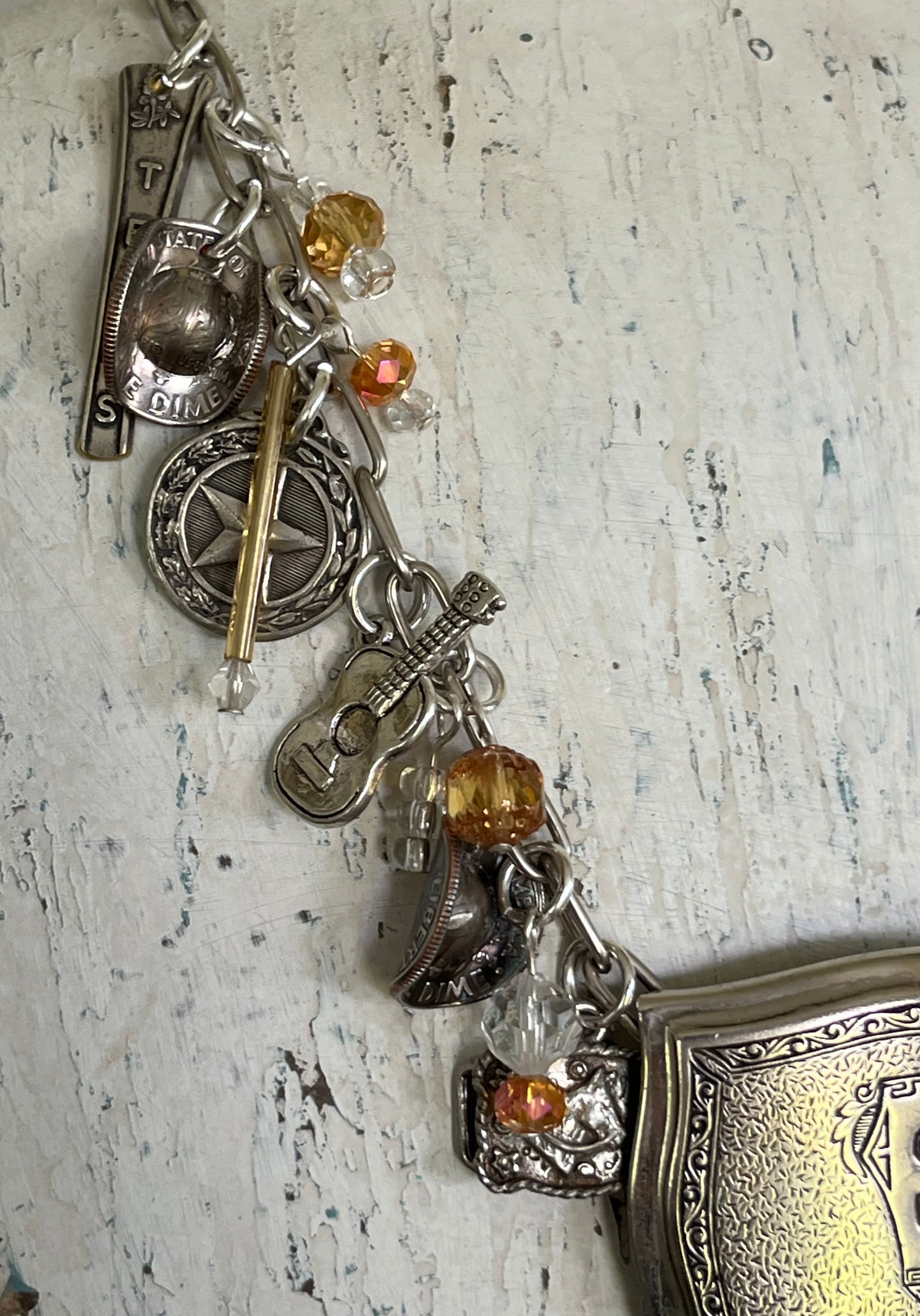 Close-up of Texas Pride spoon charms on "S" monogram Necklace - upcycled vintage silverware