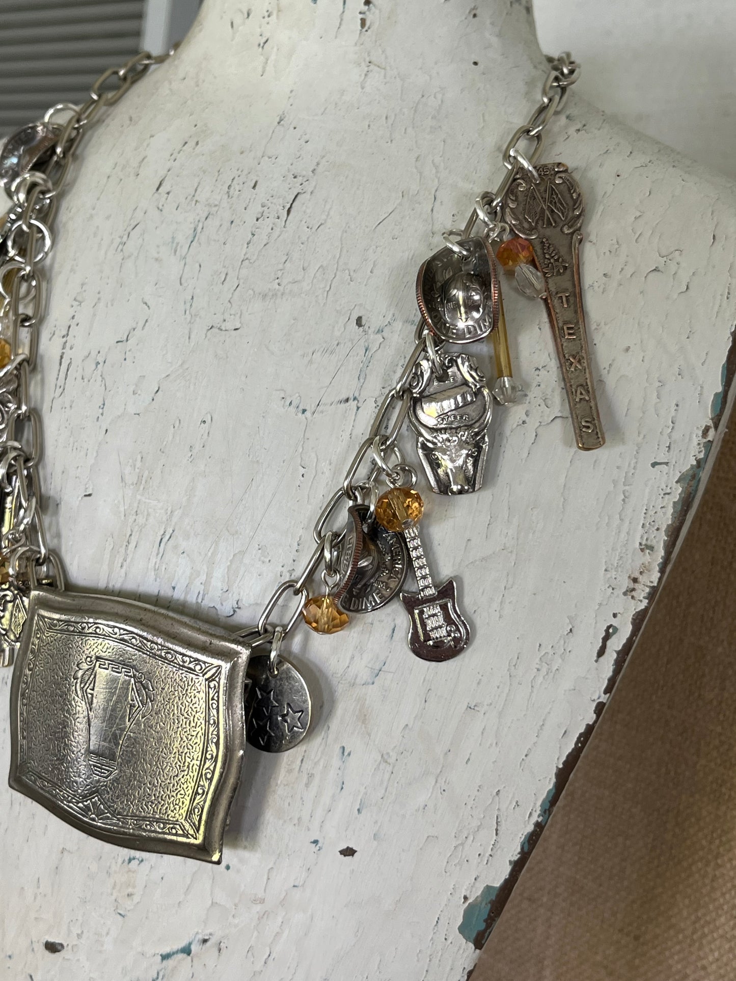 Close-up of Texas Pride spoon charm necklace - upcycled vintage silverware 