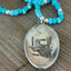 Detail view of Texas Pride pendant necklace featuring Arthur A. Everts Jewelry Co. Texas map on vintage silverware - silverware pendant necklace - handcrafted from upcycled vintage silverware - Laughing Frog Studio