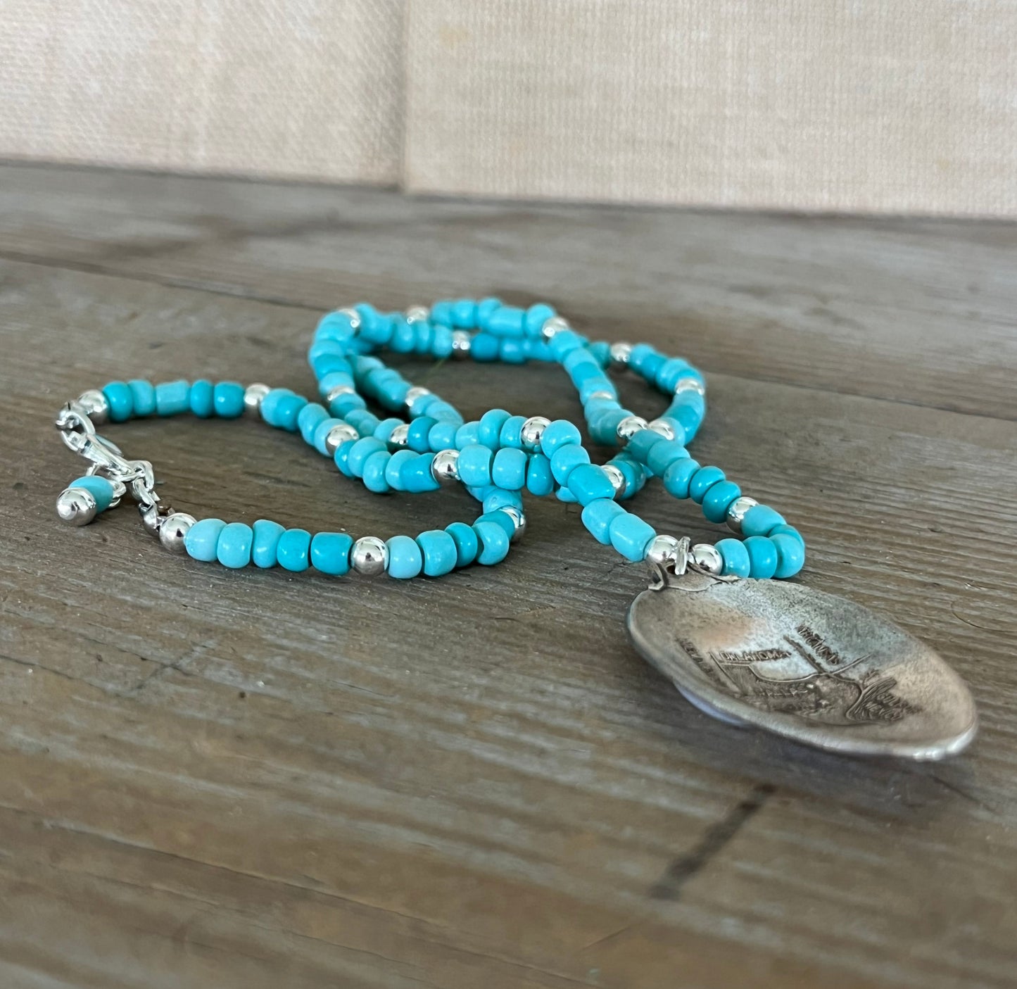 Close-up of vintage Texas map spoon bowl pendant showing Gulf of Mexico detail - silverware pendant necklace - handcrafted from upcycled vintage silverware - Laughing Frog Studio