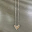 Shot of a hanging MEADOWBROOK pattern fork handle heart necklace - Fork Handle Heart Necklace - handcrafted from upcycled vintage silverware - Laughing Frog Studio