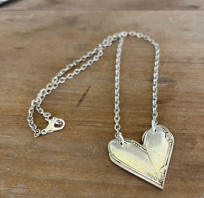 Close up of MEADOWBROOK pattern fork handle heart necklace - Fork Handle Heart Necklace - handcrafted from upcycled vintage silverware - Laughing Frog Studio