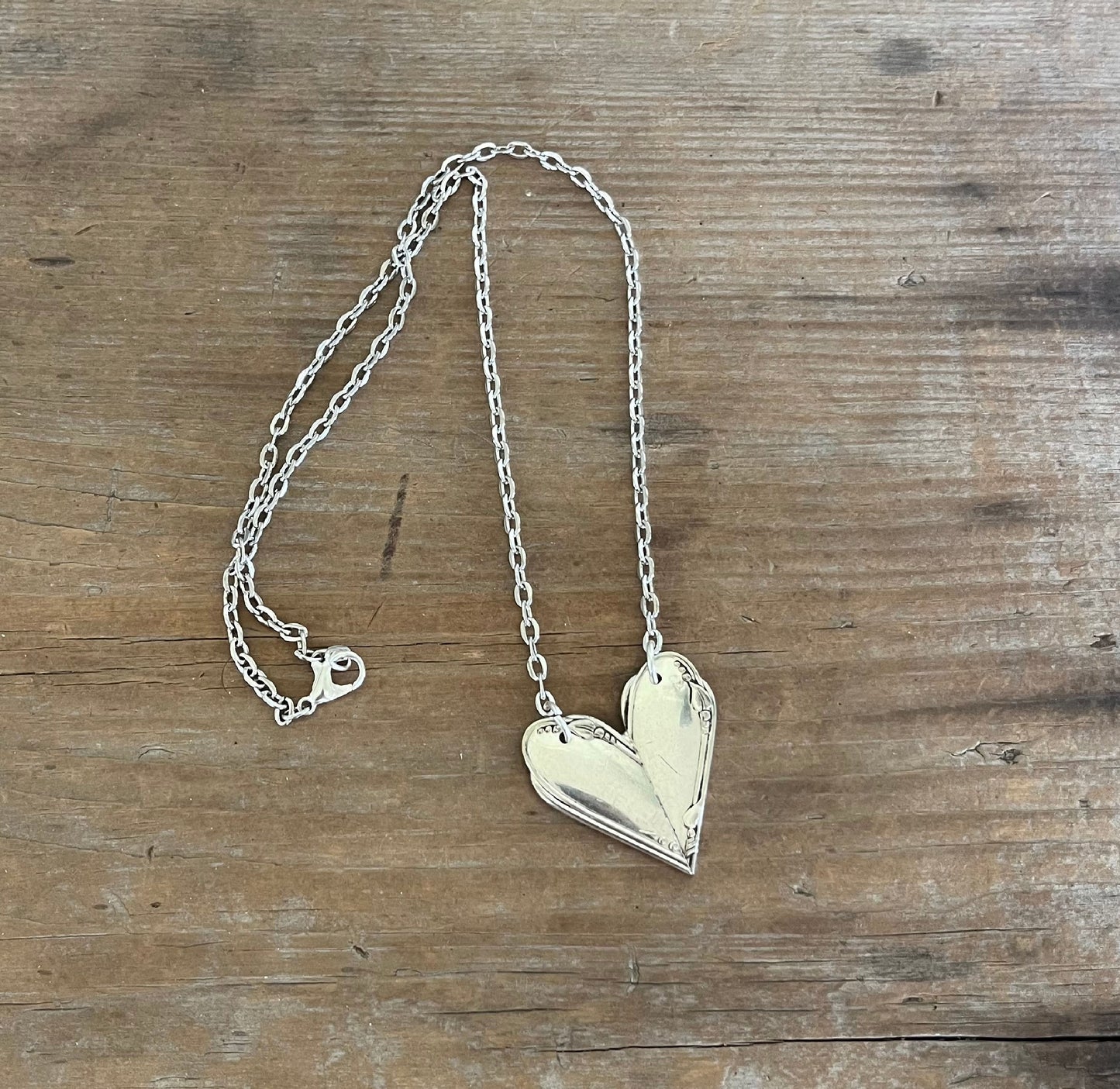 MEADOWBROOK fork handle heart pendant flat lay - Fork Handle Heart Necklace - handcrafted from upcycled vintage silverware - Laughing Frog Studio