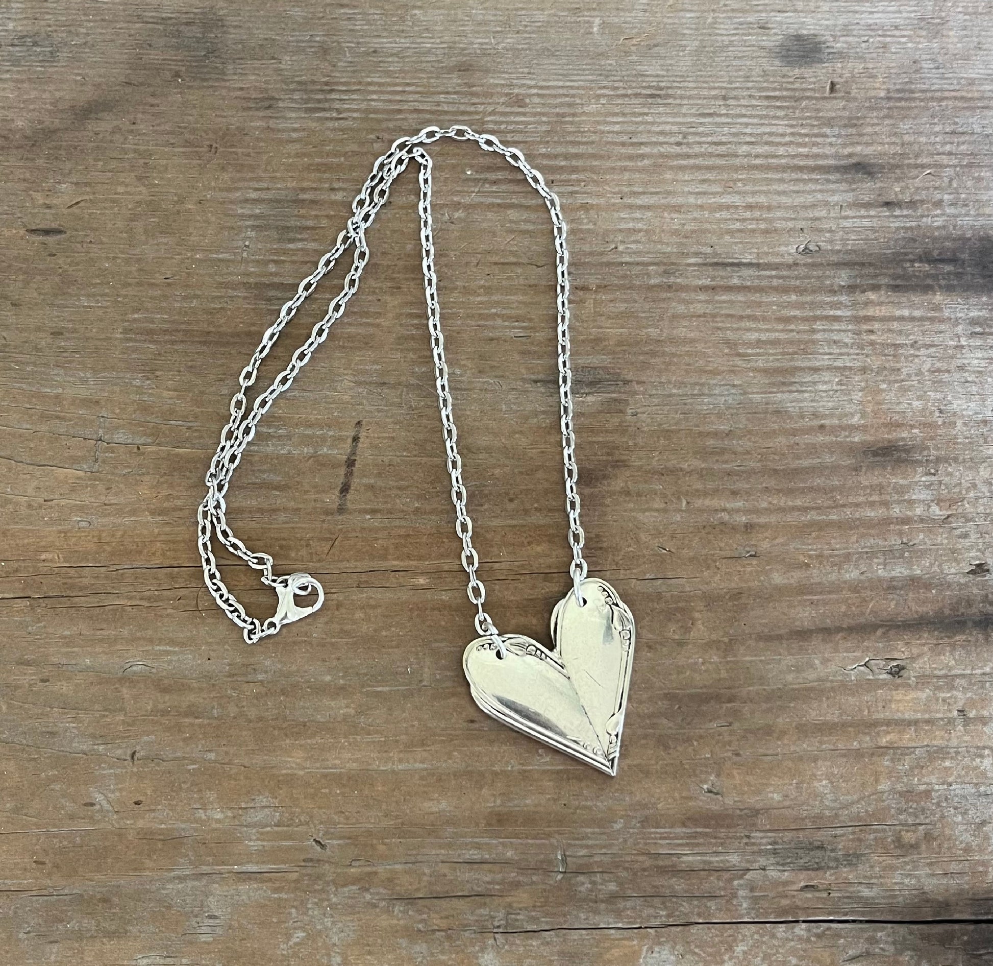 MEADOWBROOK fork handle heart pendant flat lay - Fork Handle Heart Necklace - handcrafted from upcycled vintage silverware - Laughing Frog Studio