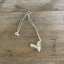 Wide angle flat lay of Cranford Sherwood silverplate heart necklace pendant - handcrafted from upcycled vintage silverware - Laughing Frog Studio