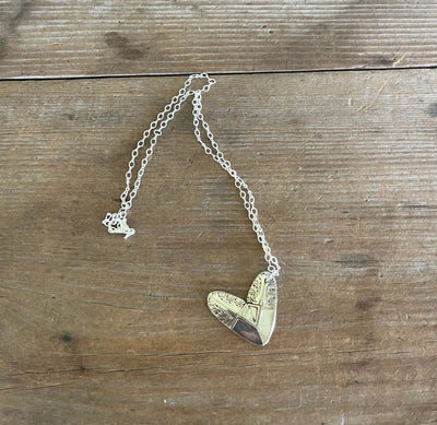Wide angle flat lay of Cranford Sherwood silverplate heart necklace pendant - handcrafted from upcycled vintage silverware - Laughing Frog Studio