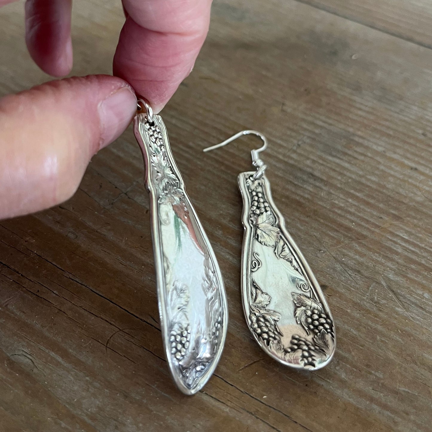 Front and back view of handcrafted La Concorde spoon earrings showing vintage silverplate patina and detail