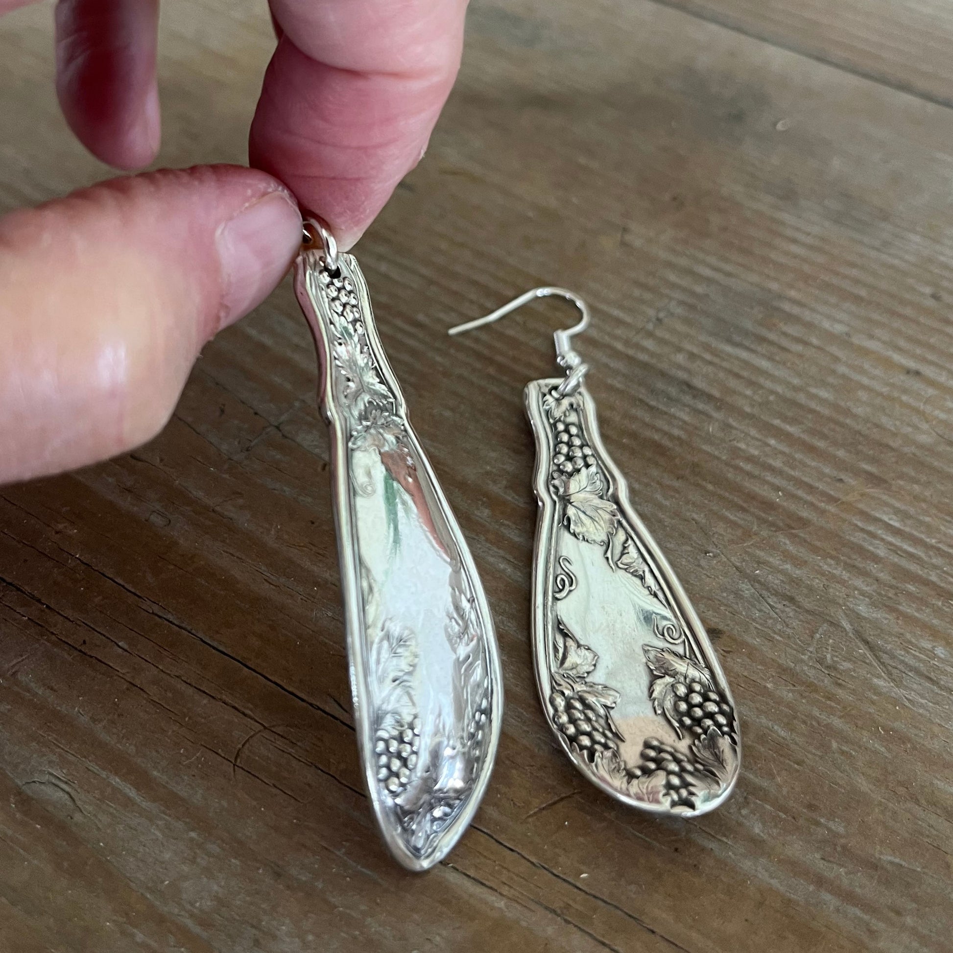 Front and back view of handcrafted La Concorde spoon earrings showing vintage silverplate patina and detail
