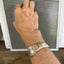Silver spoon cuff bracelet with floral rose pattern stamped fuckity on model's wrist - Oneida Ballad cuff bracelet - handcrafted from upcycled vintage silverware - Laughing Frog Studio